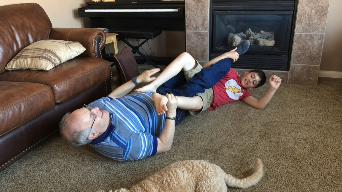 Grandfather playing with grandchild